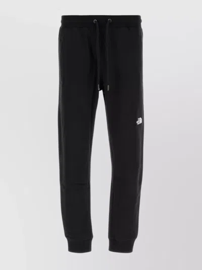 The North Face Cotton Joggers With Elastic Waistband And Ribbed Cuffs In Black