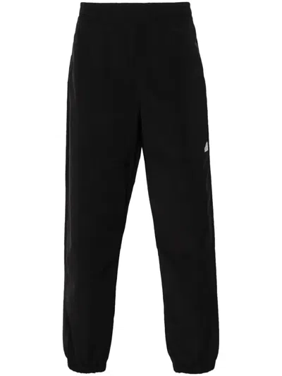 The North Face Easy Wind Tapered Trousers In Black