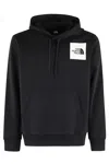 The North Face Logo Patch Drawstring Hoodie In Black