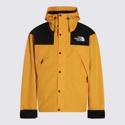 The North Face Yellow And Black Casual Jacket In Gold