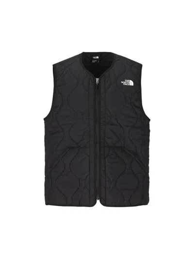 The North Face Logo Printed Padded Vest In Black