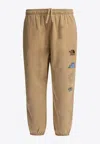 The North Face Graphic Print Elastic Waistband Trousers In Brown