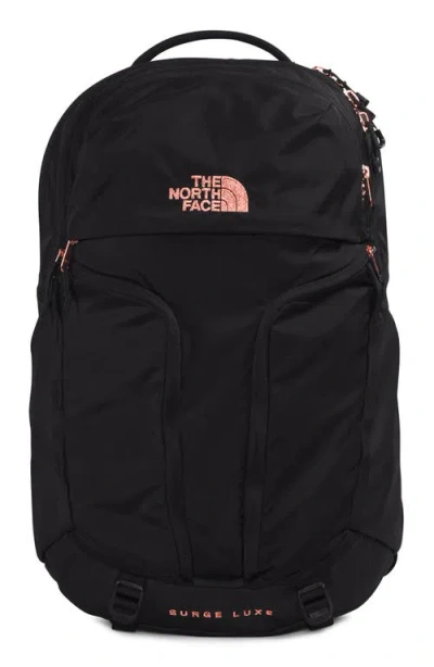 The North Face Surge Luxe Water Repellent Ripstop Backpack In Tnf Black/burnt Coral-npf