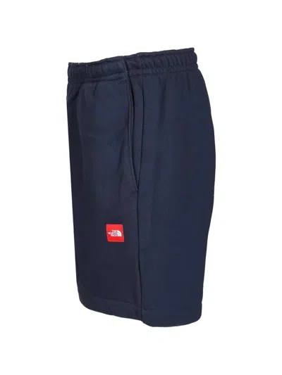 The North Face Tnf Red Box Shorts In Blue
