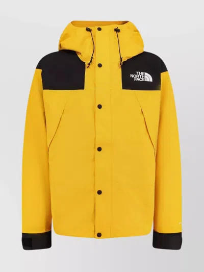 The North Face Windbreaker Jacket With Drawstring And Hood In Yellow
