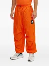 The North Face Xyinka Ilori Drawstring Zip-pocket Track Pants In Orange