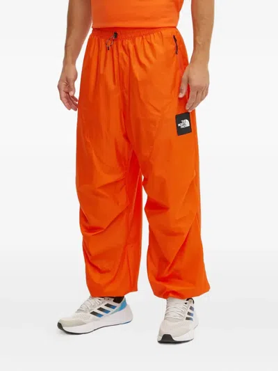 The North Face Xyinka Ilori Drawstring Zip-pocket Track Pants In Orange
