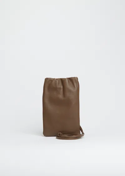 The Row Bourse Phone Case In Brown