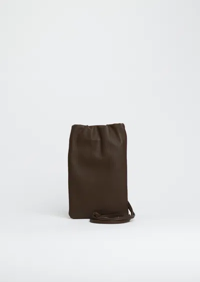 The Row Bourse Phone Case In Brown
