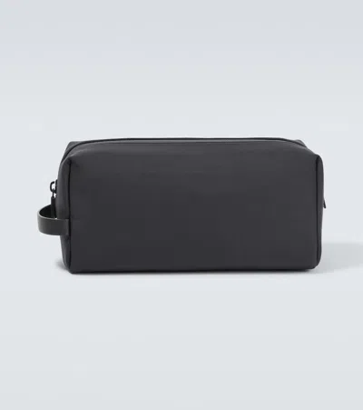 The Row Clovis Leather-trimmed Toiletry Pouch In Blue