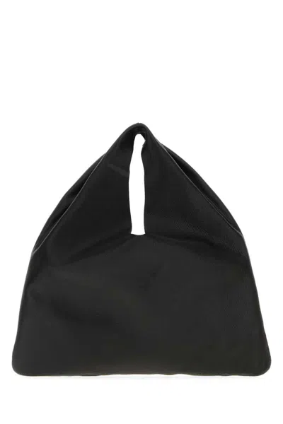 The Row Handbags. In Black