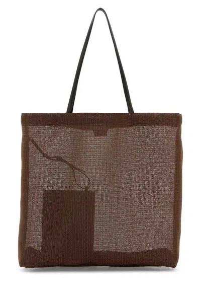 The Row Handbags. In Brown