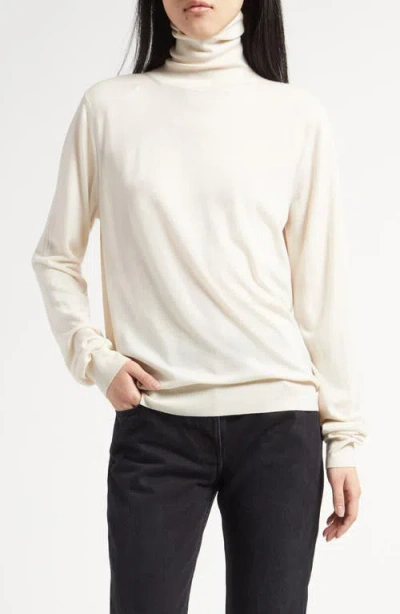 The Row Heva Turtleneck Wool Top In Shell