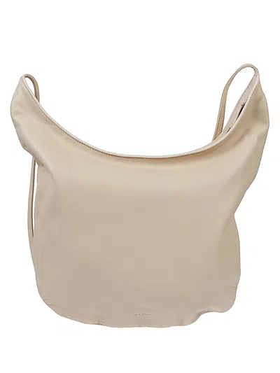 The Row Izzy Leather Shoulder Bag In Sand