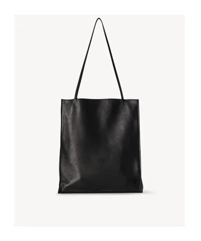 The Row Large To Go Handbag In Black