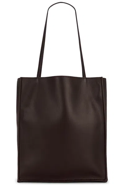 The Row Large To Go Tote Bag In Dark Brown Ans