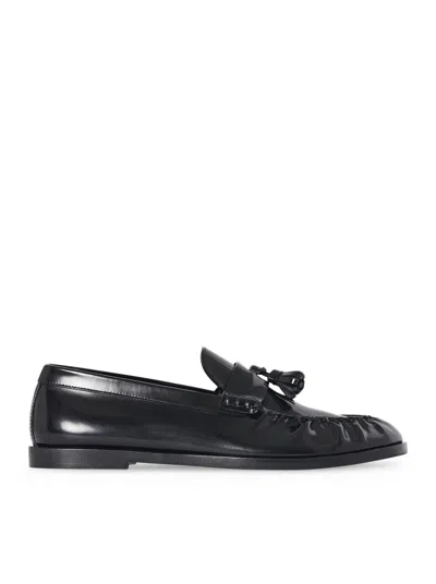 The Row Flat Sole Leather Loafers Featuring Tassel Detail In Black