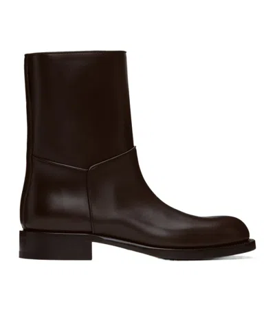 The Row Textured-leather Boots In Black