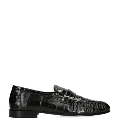 The Row Soft Fish Skin Loafers In Black