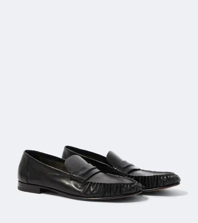 The Row Theo Leather Penny Loafers In Black