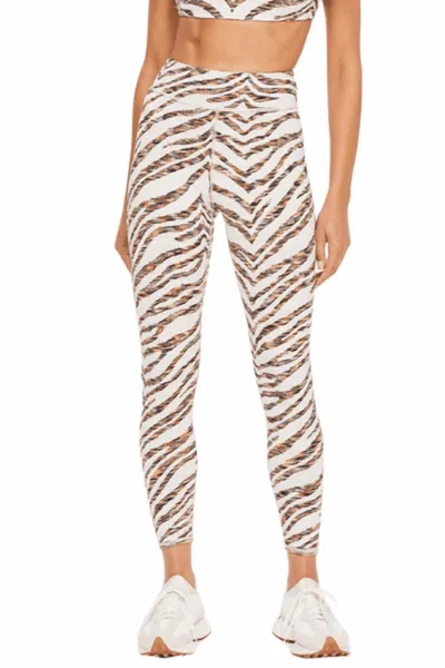 THE UPSIDE NIKA REVERSIBLE 25IN MIDI PANT IN GOLD MULTI