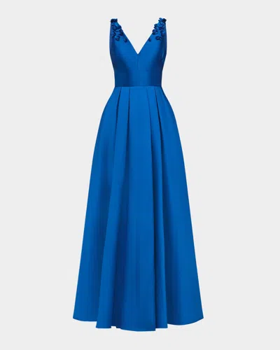 Theia Velina Pleated Floral Applique Mikado Gown In Blue
