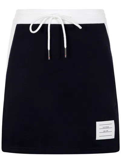 THOM BROWNE MINI SKIRT W/ ENGINEERED 4 BAR IN BLOCKED CLASSIC SOLID CL,FJK130A.03037 415 NAVY