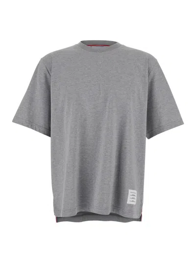 THOM BROWNE GREY CREWNECK T-SHIRT WITH LOGO PATCH ON THE FRONT AND STRIPED DETAIL ON THE REAR IN COTTON MAN