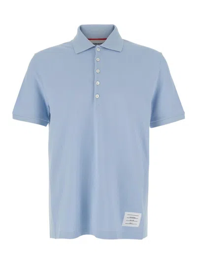 THOM BROWNE LIGHT BLUE POLO SHIRT WITH FOUR STRIPE DETAIL AND LOGO PATCH ON THE FRONT IN COTTON MAN