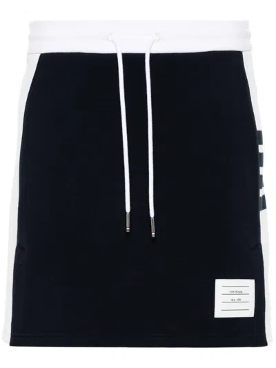 THOM BROWNE THOM BROWNE MINI SKIRT W/ ENGINEERED 4 BAR IN BLOCKED CLASSIC SOLID CLASSIC LOOPBACK JERSEY