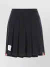 THOM BROWNE MINI SKIRT WITH PLEATED DESIGN AND CONTRAST STRIPE DETAIL