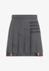 Thom Browne Thigh Length Dropped Back Pleated Skirt In Gray