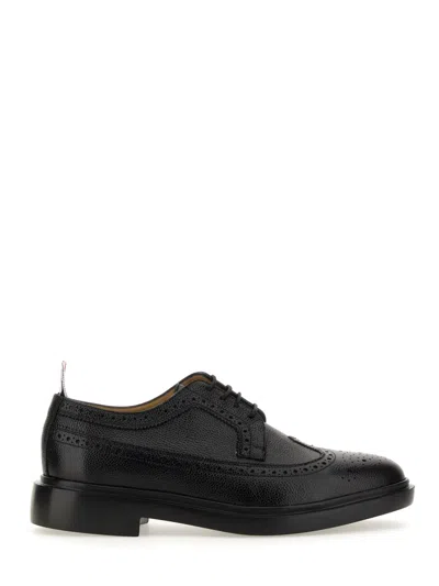 Thom Browne Stringata Longwing Brogue For Men In Black