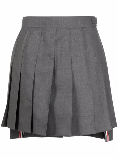 THOM BROWNE THIGH LENGTH DROPPED BACK PLEATED SKIRT