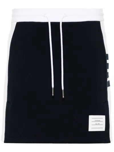 THOM BROWNE THOM BROWNE WOMEN MINI SKIRT W/ ENGINEERED 4 BAR IN BLOCKED CLASSIC SOLID CLASSIC LOOPBACK JERSEY