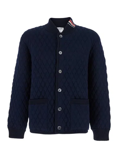 THOM BROWNE BLUE QUILTED JACKET WITH BOMBER COLLAR AND LOGO EMBROIDERY ON THE COLLAR IN WOOL MAN