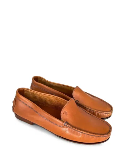 Tod's Gommino Embossed-monogram Leather Loafers In Brown