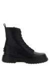 Tod's Chunky Sole Round Toe Ankle Boots With Pull Tab In Black