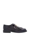 Tod's Loafer With Buckle And Fringe Detailing In Black
