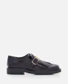 Tod's Loafer With Buckle And Fringe Detailing In Black