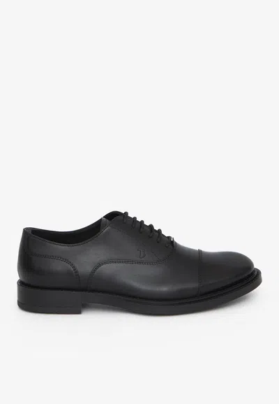 Tod's Logo Stamp Leather Oxford Shoes In Black