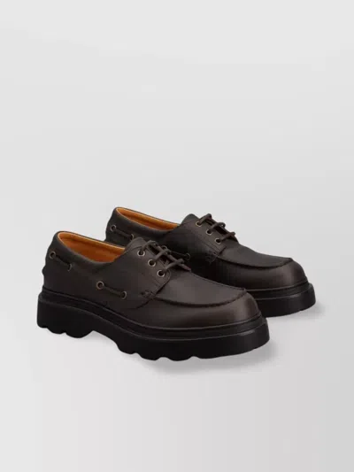 Tod's Lug Sole Leather Boat Shoes In Black