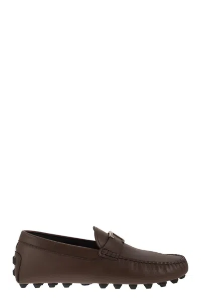 TOD'S MEN'S LEATHER MOCCASINS WITH GROMMET DETAIL AND RUBBER SOLE