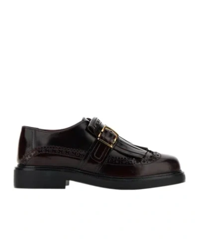 TOD'S TOD'S FRINGE-DETAIL PERFORATED LOAFERS