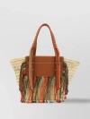 TOD'S TEXTURED WOVEN TOTE WITH BRAIDED HANDLES AND FRINGE DETAIL