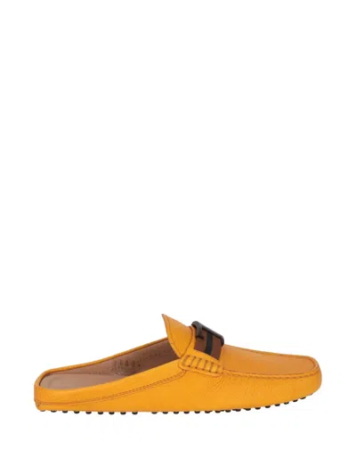 Tod's T-logo Gommino Mules In Yellow