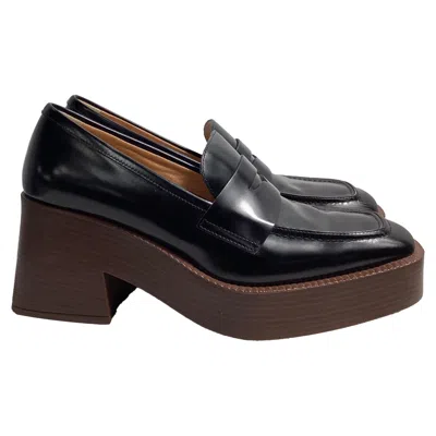 TOD'S TOD'S 75MM PLATFORM LOAFERS IN BLACK LEATHER