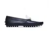 Tod's Metal Branded Bar Two-tone Leather Gommino Driving Shoes In Black