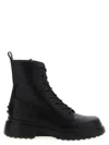 Tod's Chunky Sole Round Toe Ankle Boots With Pull Tab In Black