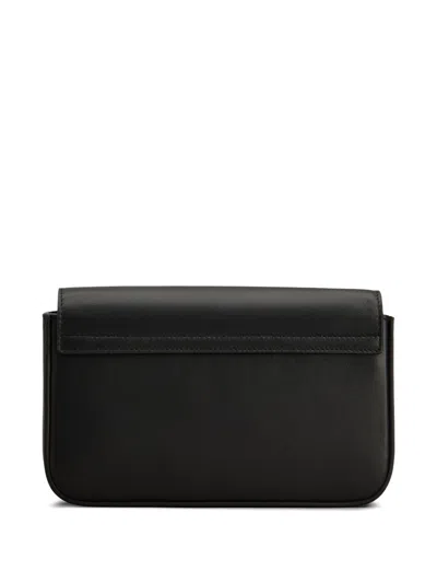 Tod's Mini Flap Bag In Black Leather With Metal Shoulder Strap.